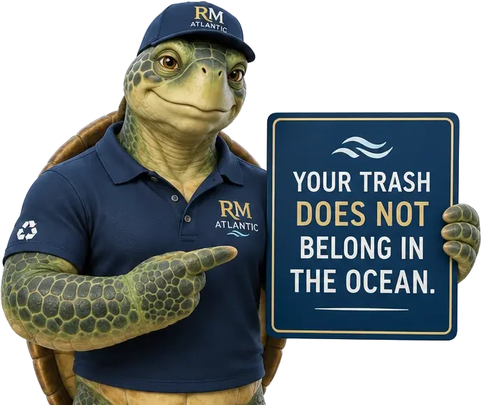 Tuga Blue pointing to a sign that says your trash does not belong in the ocean